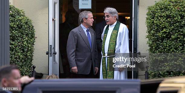 President George W. Bush talks with Reverend Dr. Luis Leon, rector of St. John's Episcopal Church, after the seven-forty-five Sunday Church service...