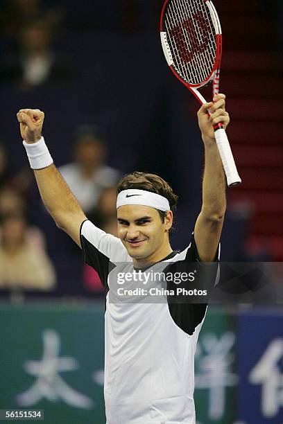Roger Federer of Switzerland celebrates after defeating David Nalbandian of Argentina during the first round of the Tennis Masters Cup at Qi Zhong...