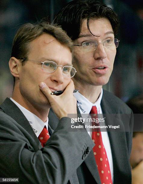 Coach Greg Poss and second Coach Uwe Krupp of Germany react during the TUI Nations Cup match between Canada and Germany at the TUI Arena on November...