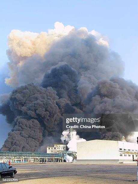 Smoke billows from the Jilin Petroleum and Chemical Company after a series of explosions November 13, 2005 in Jilin City, some 100 km east from...