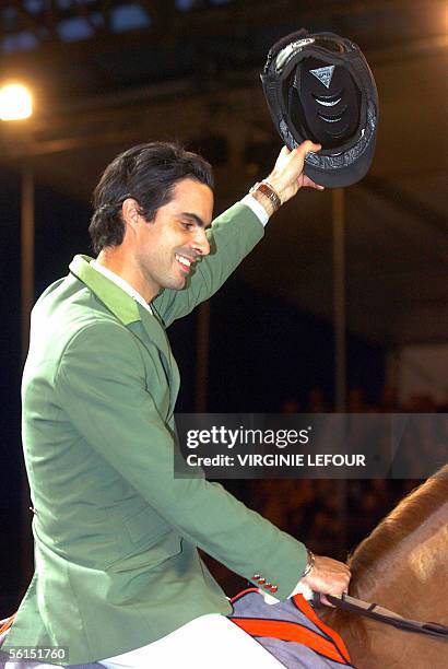 Brazilian Rodrigo Pessoa on Baloubet du Rouet celebrates after winning the Grand Prix in the International Jumping of Brussels, 13 November 2005. AFP...
