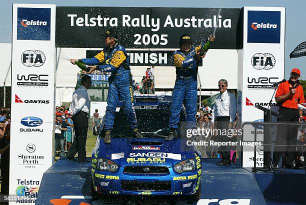 Toshihiro Arai of Japan and Tony Sircombe of New Zealand celebrate on top of their Subaru Impreza at the end of Leg 3 of the WRC Telstra Rally...