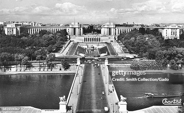 View across a historic bridge over the River Seine to the Palais de Chaillot, Paris, France, 1962.