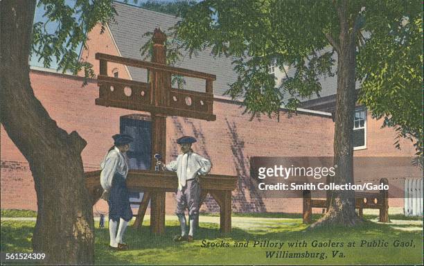 Stocks and pillory with gaolers at public gaol, Williamsburg, Virginia, 1939.