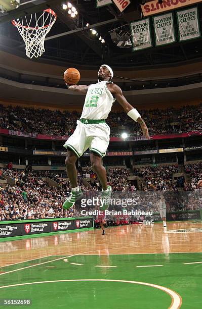 Ricky Davis of the Boston Celtics dunks against the Houston Rockets on November 13, 2005 at the TD Banknorth Garden in Boston, Massachusetts. NOTE TO...