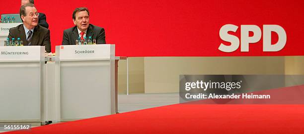 Karlsruhe, GERMANY Franz Muentefering and Gerhard Schroeder look around during day one of the three-day party convention of the Social Democratic...