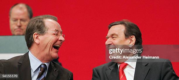 Franz Muentefering and chancellor Gerhard Schroeder are laughing during a three-day party conference of the Social Democratic Party at the Messehalle...