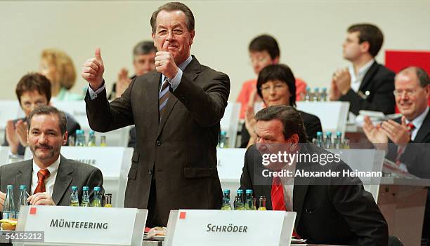 Outgoing SPD leader Franz Muentefering and outgoing German Chancellor Gerhard Schroeder gesticulate during a three-day party conference of the Social...