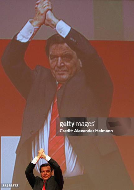 Outgoing Chancellor Gerhard Schroeder bids farewell to the audience during the three-day party congress of the Social Democratic Party at the...
