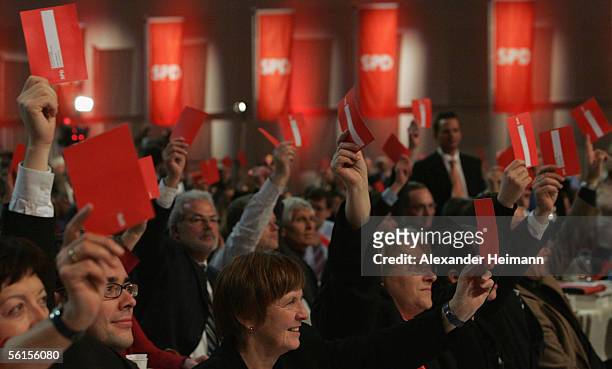 Party members vote for the coalition-contract during the three-day party congress of the Social Democratic Party at the Messehalle on November14,...