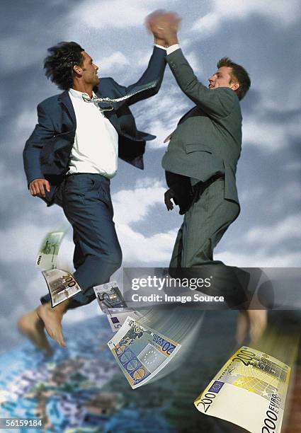 joyful businessmen - two hundred euro banknote stock pictures, royalty-free photos & images