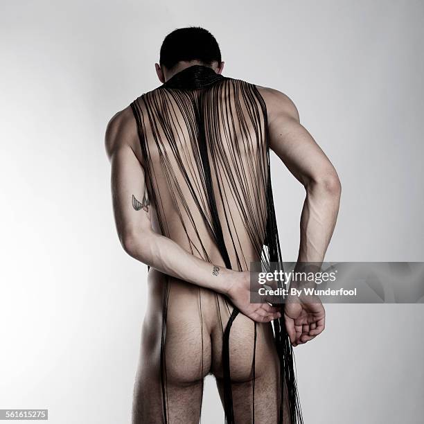 un-bound. - male buttocks stockfoto's en -beelden