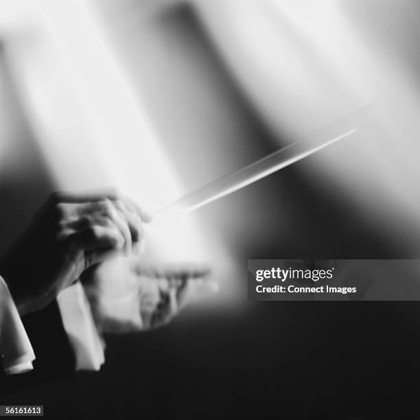 conductor with baton - dirigent stock-fotos und bilder