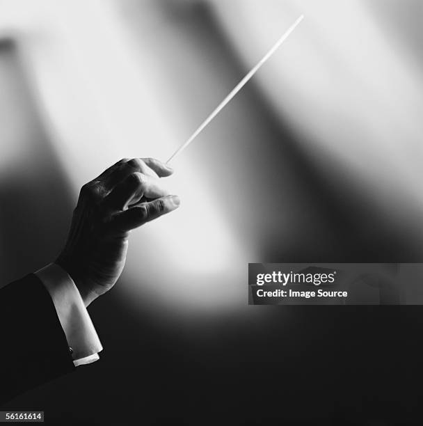 conductor with baton - conductor's baton stock pictures, royalty-free photos & images