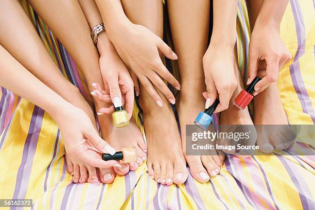 girlfriends at home - female feet stockfoto's en -beelden