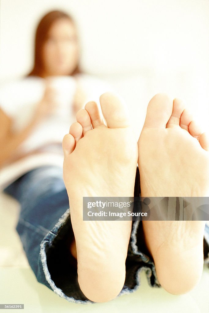 Woman relaxing on sofa