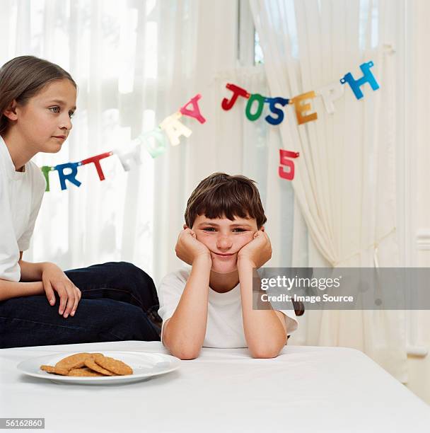 boy and girl at birthday party - sad birthday stock pictures, royalty-free photos & images