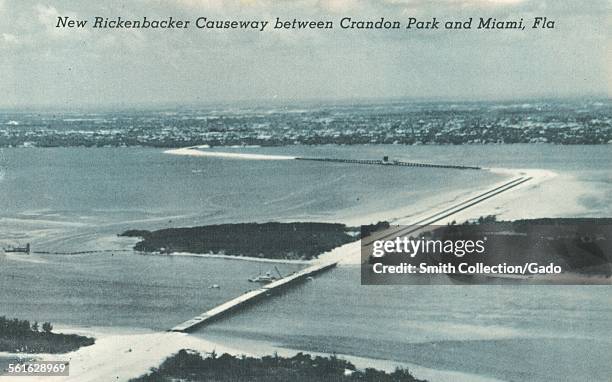 Four miles over water from Miami, across Biscayne Bay, this portion of the Rickenbacker Causeway leaves Virginia Key, stretches on to Key Biscayne...