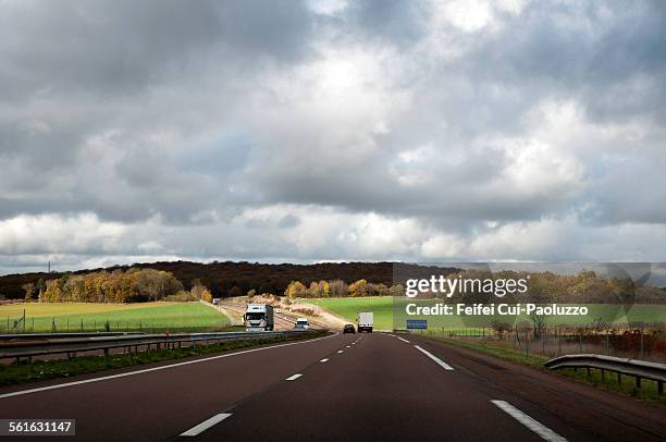 road at joux-la-ville, yonne department, france - automne ville stockfoto's en -beelden