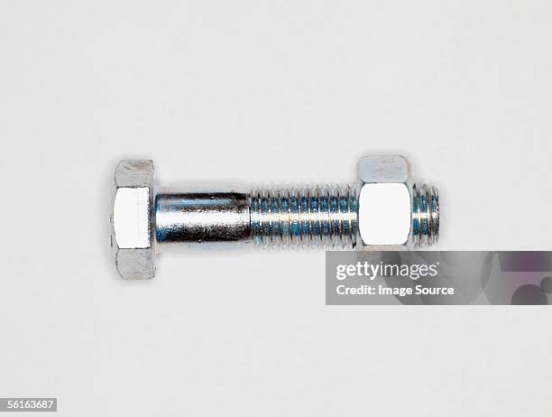 nut and bolt - nut fastener stock-fotos und bilder