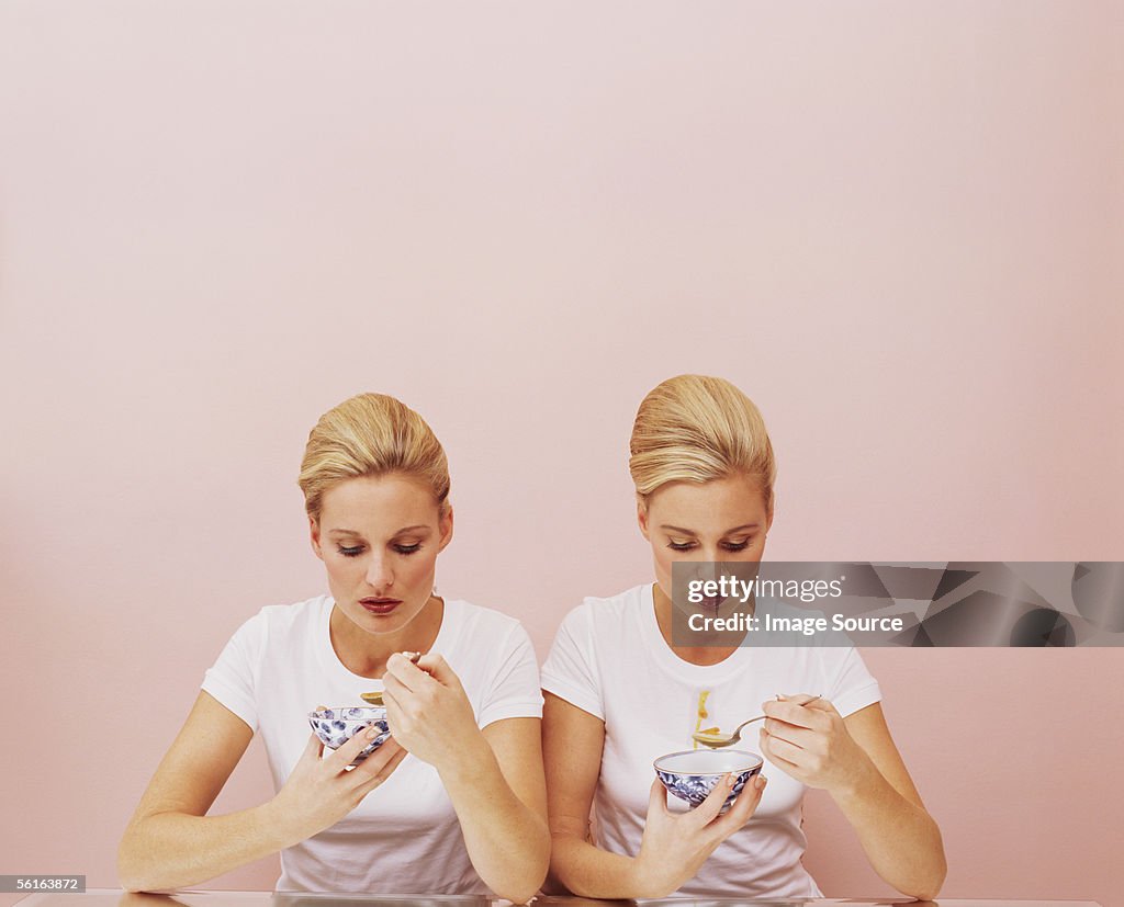 Two women eating soup