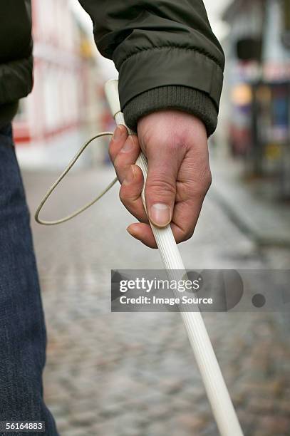 blind man using a cane - 白杖 ストックフォトと画像