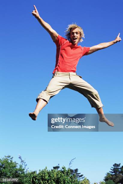 Guy Jumping On Trampoline Photos and Premium High Res Pictures - Getty ...