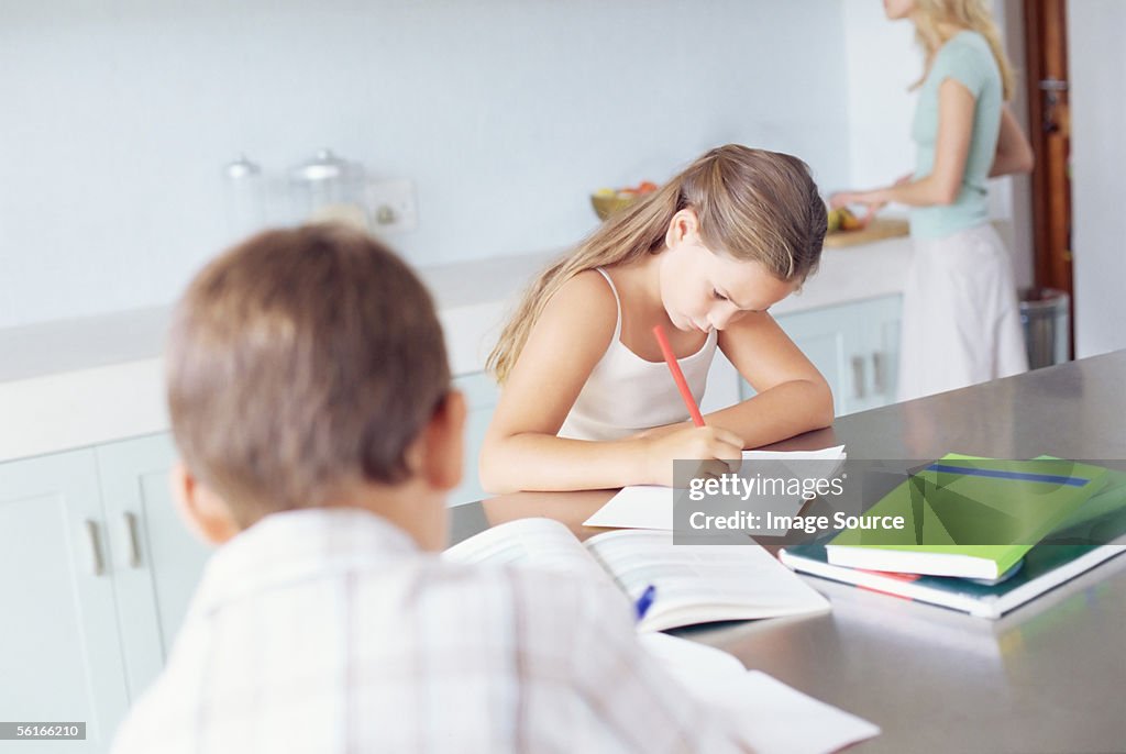 Children doing homework in the kitchen