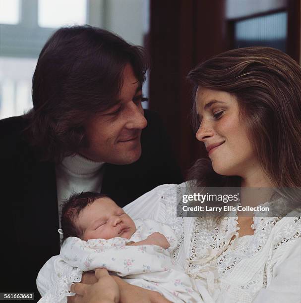 English actress Charlotte Rampling with her husband Bryan Southcombe and their new baby Barnaby Southcombe, September 1972.