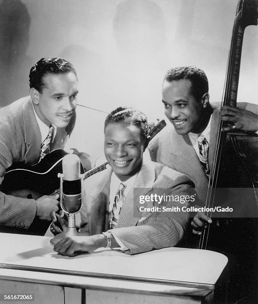 Singer and Jazz musician Nat King Cole, Oscar Moore and Wesley Prince, 1949.