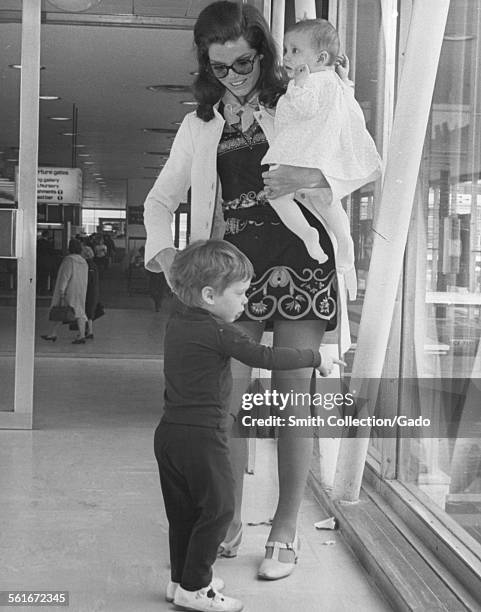 Samantha Eggar, a good show business mother, with her two children, Nicholas Stern, 2 1/2, and Jenna Stern, 6 months prior to flying to America, 1968.