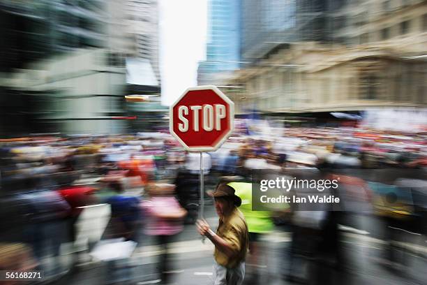 Man with a placard takes part in a demonstration opposing the Australian Federal Government's planned new industrial relations laws November 15, 2005...