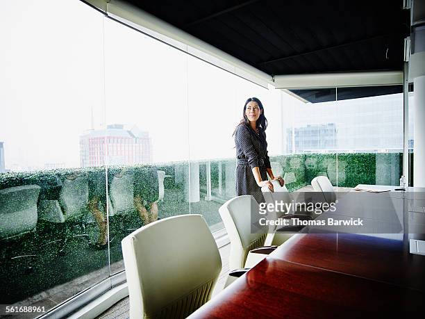 Smiling businesswoman in office conference room
