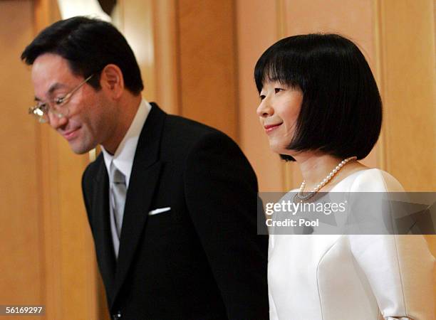 The new bride and groom Mrs Sayako Kuroda and Yoshiki Kuroda attend a news conference following their wedding ceremony at a Tokyo hotel during a news...