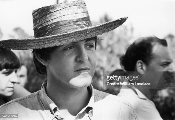 Beatles singer and songwriter Paul McCartney wearing a straw hat while filming 'Help' in The Bahamas, 2nd March 1965.