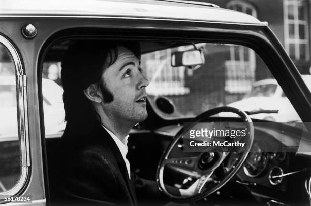 Singer songwriter Paul McCartney leaving the Apple headquarters in Savile Row, London, 19th April 1969.