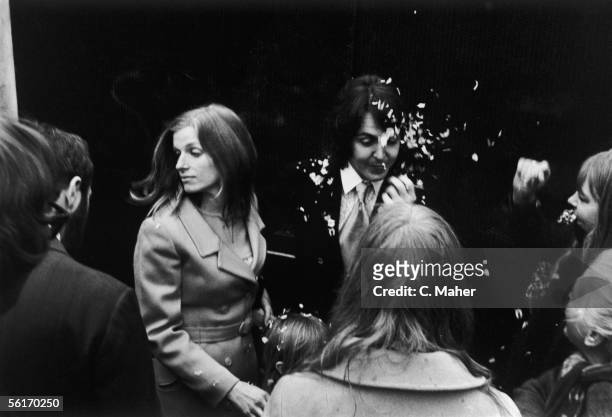 Well wishers throw confetti as singer songwriter Paul McCartney and his new wife Linda, nee Eastman, leave Marylebone Registry Office, London, after...