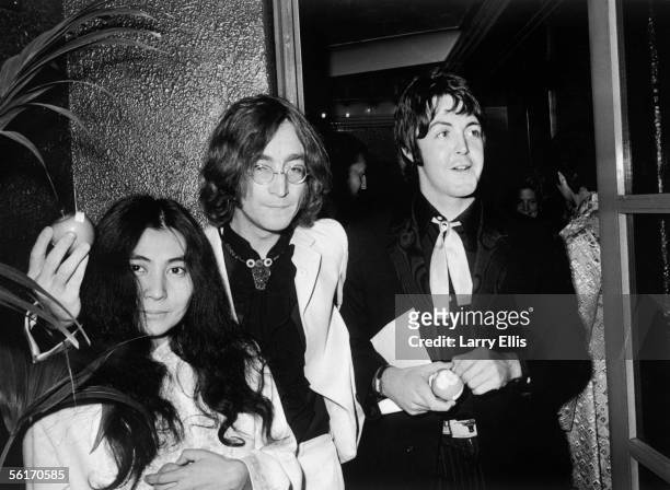 Beatle John Lennon and his Japanese girlfriend Yoko Ono with Beatle Paul McCartney , at the premiere of the new Beatles film 'Yellow Submarine' at...