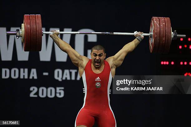 Pashayev Nizami of Azerbaijan competes in the men's 94kg category at the World Weightlifting Championship in Doha, 15 November 2005. Nizami won the...