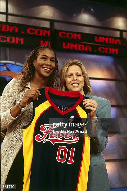 Tamika Catchings of the Indiana Fever poses with Val Ackerman, President of the WNBA in the WNBA Draft 2001 in Secaucus, New Jersey. NOTE TO USER:...