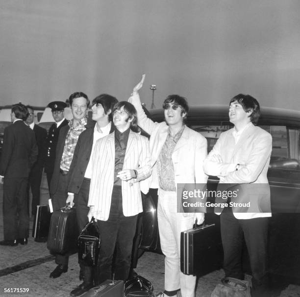 The Beatles and their manager Brian Epstein arrive back in London from Manila after their tour of Germany, Japan and the Philippines, 8th July 1966.