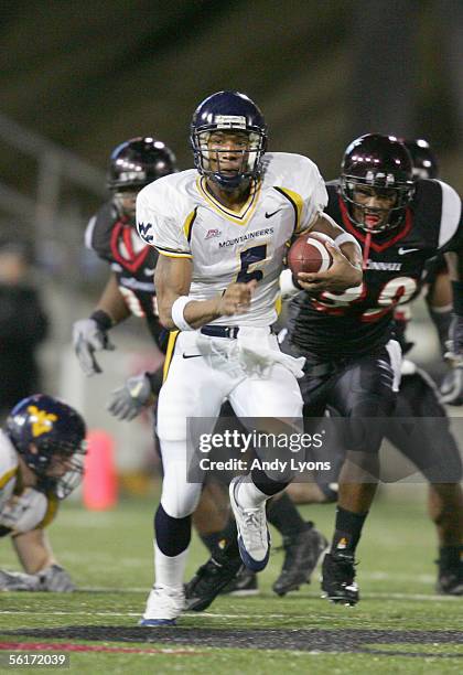 Quarterback Pat White of the West Virginia Mountaineers runs the ball during the game against the Cincinnati Bearcats at Nippert Stadium on November...