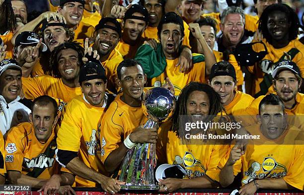 Members of the Los Angeles Galaxy pose with the Alan I. Rothenberg trophy after defeating the New England Revolution 1-0 in overtime to win MLS Cup...