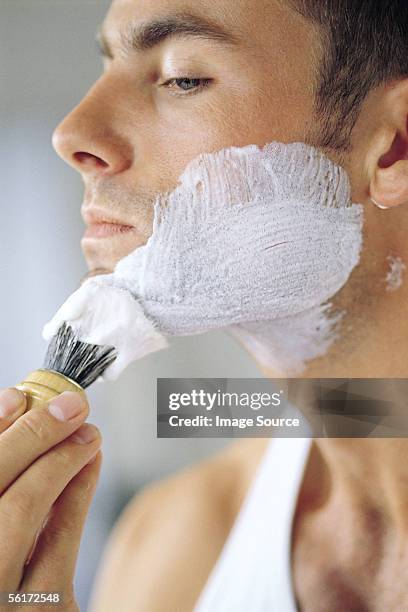 applying shaving foam - shaving brush stock pictures, royalty-free photos & images