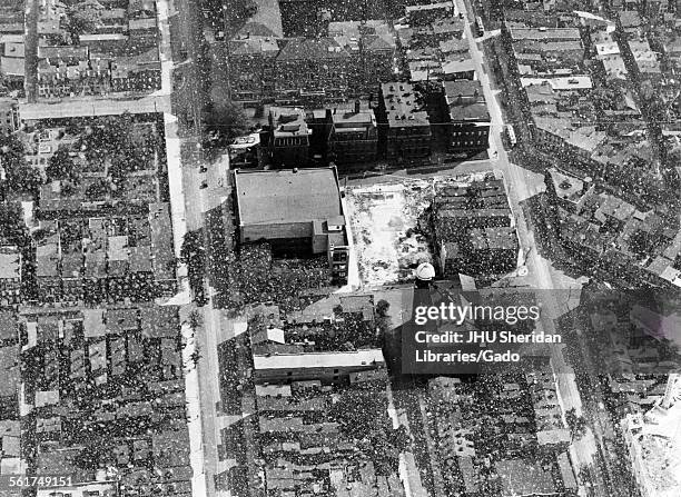 Aerial Views, Old Campus looking south, after burning of McCoy and Levering Halls, Roofs of buildings shown, with non-Hopkins buildings covered with...