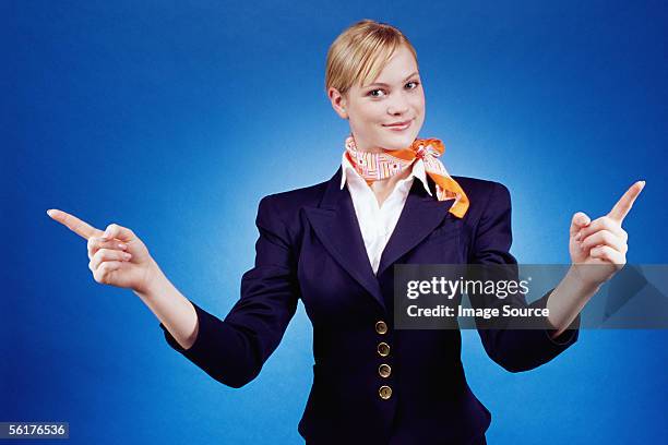 air hostess pointing - air stewardess stockfoto's en -beelden