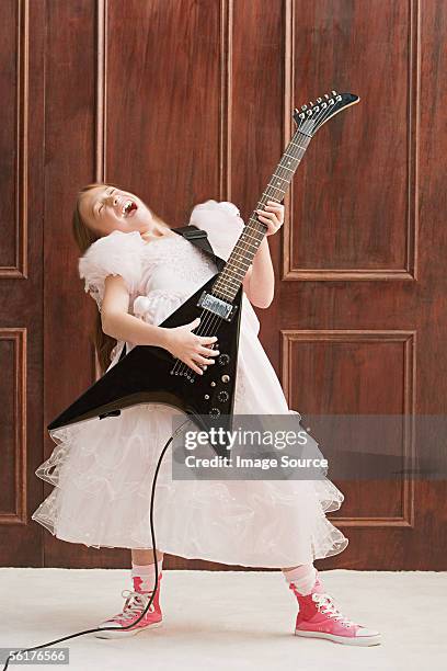 girl playing electric guitar - bridesmaid stock pictures, royalty-free photos & images