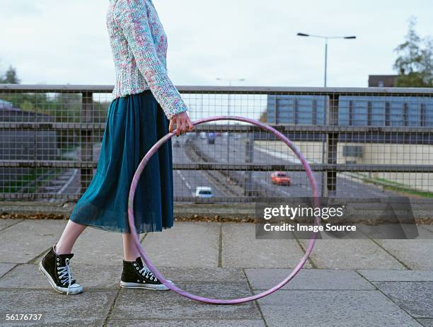 woman with hula hoop on motorway bridge - skirt stock pictures, royalty-free photos & images