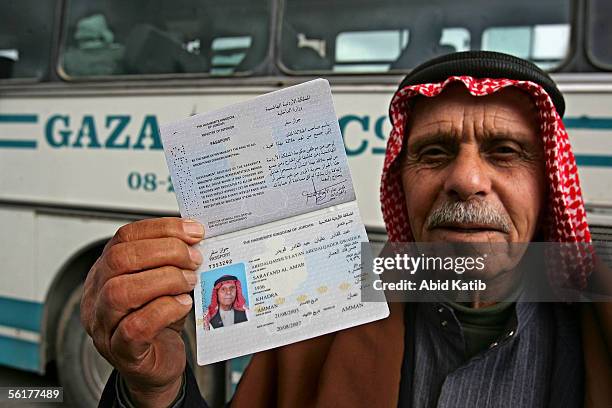 Palestinian refugee, Abed Alqader Qwaider shows his temporary Jordanian passport as he comes to visit his relatives, November 15, 2005 at the border...