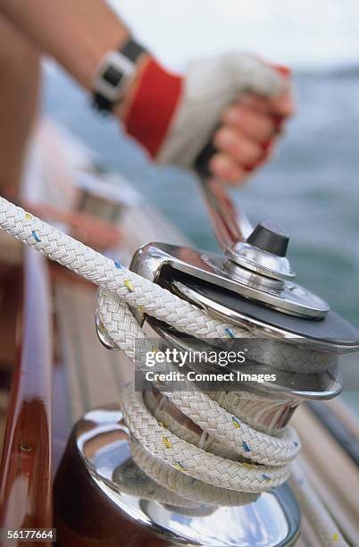 man cranking capstan - pulling boat stock pictures, royalty-free photos & images